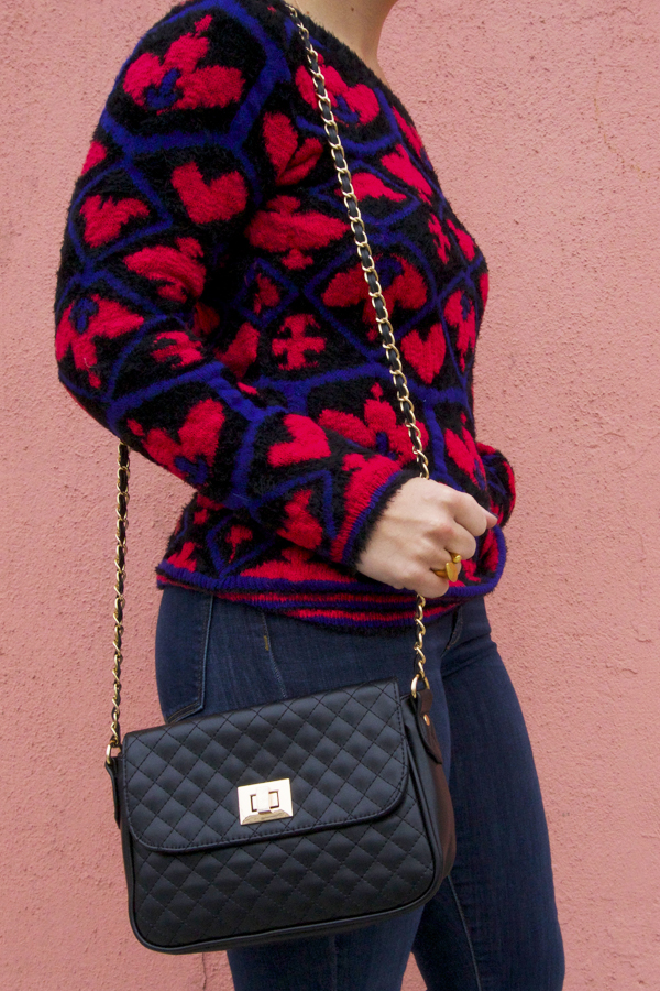 gold ring, bag and queen of hearts sweater